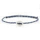 Silver button on a blue and white paracord bracelet